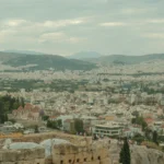 a view of a city from the top of a hill